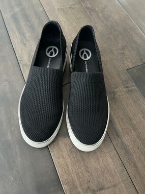 The WISHBONE Slip-On Wedge Sneakers in Black